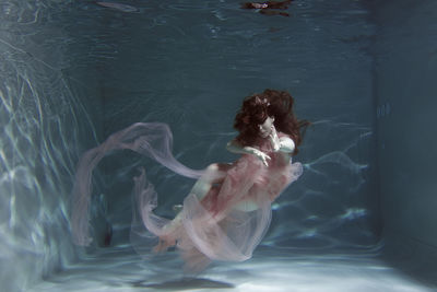 Woman swimming in sea