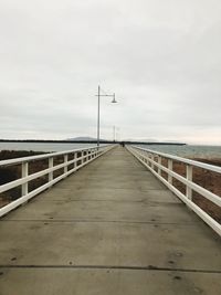 Bridge over sea against sky