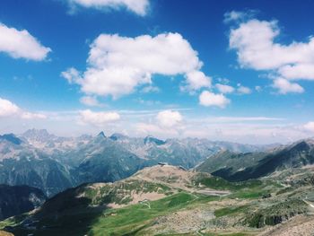 Panoramic shot of countryside landscape against clouds