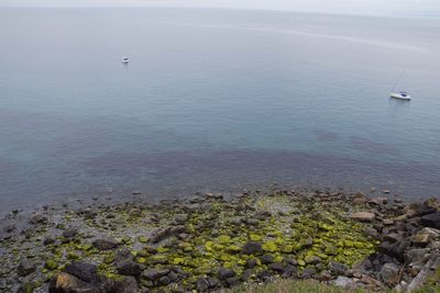 High angle view of sailboats on sea against sky