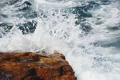 Waves splashing on rocks