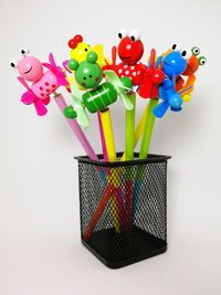 Multi colored pencils over white background
