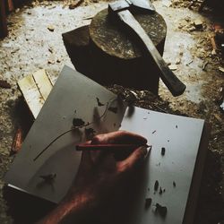 Close-up of hands working on table