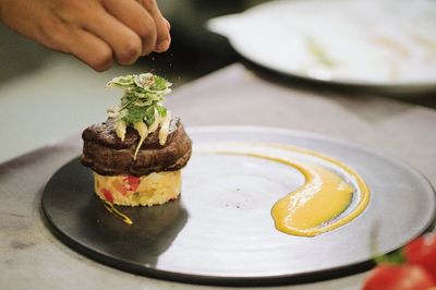 Steak with rice on a plater.