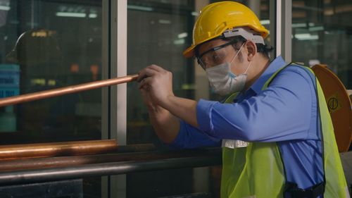 Man working in glass container