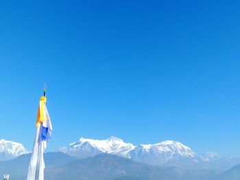 Flag against clear blue sky