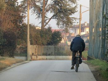 Full length of woman walking on footpath