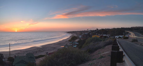 Scenic view of beach at sunset