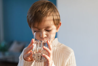 Young woman drinking water