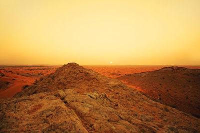 Dubai desert at sunset with mountains 