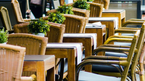 Empty chairs and tables in restaurant