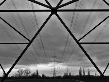 Low angle view of electricity pylon against sky