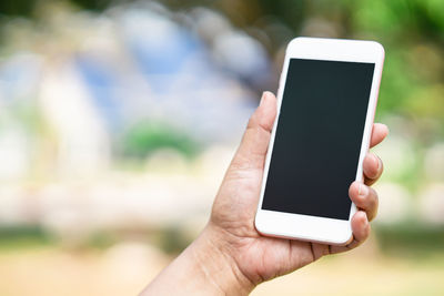 Close-up of person holding mobile phone
