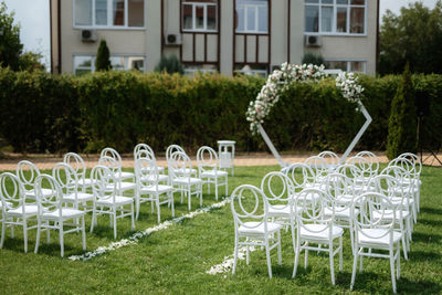 Empty chairs and tables in park