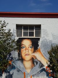 Portrait of man against window