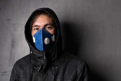Portrait of man wearing pollution mask