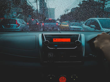 Car moving on wet road in rainy season