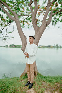 Full length of woman standing on field
