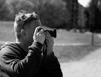 Close-up of boy photographing