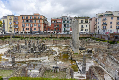 Buildings in city against sky