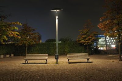 Empty bench at night