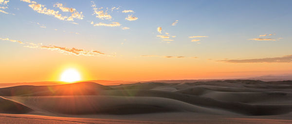 Scenic view of landscape against sky during sunset