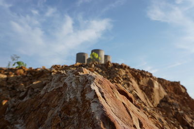 Low angle view of rock formation against sky