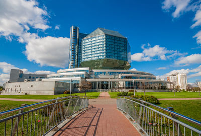 View of modern building against cloudy sky