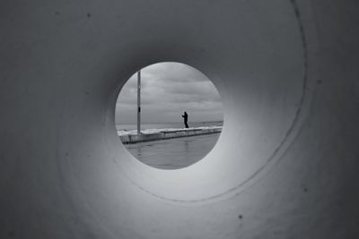 Reflection of sky seen through hole in tunnel to perspective