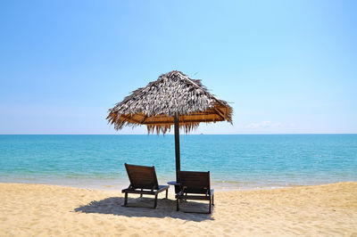 Sun loungers on calm beach