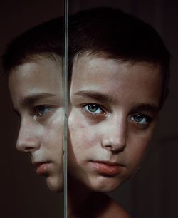 Close-up portrait of boy reflecting on mirror