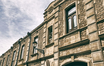 Low angle view of old building against sky