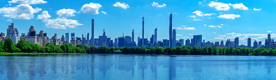 Panoramic view of modern buildings against sky