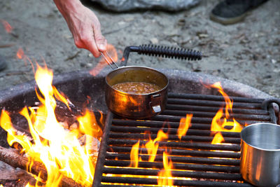 Burning candles on barbecue grill