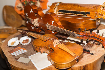 High angle view of violin on wooden table