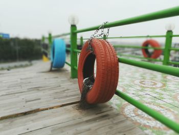 Close-up of ropes hanging on wood