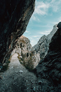 Rock formations on mountain against sky