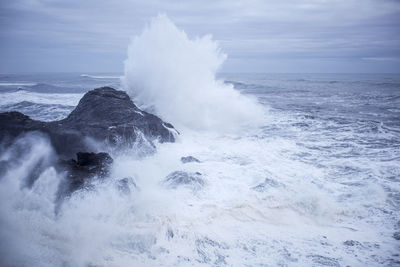Scenic view of sea waves against sky