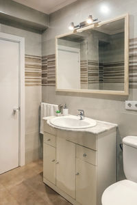 Bathroom interior decorated with sink and toilet