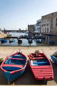 Boats moored at harbor