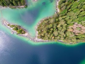 High angle view of sea by landscape