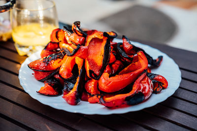 Grilled red bell pepper on plate. grill baked vegetable pepper, grilled fresh portion ready to eat,