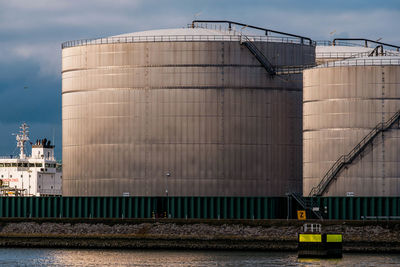 Petrol silos against sky