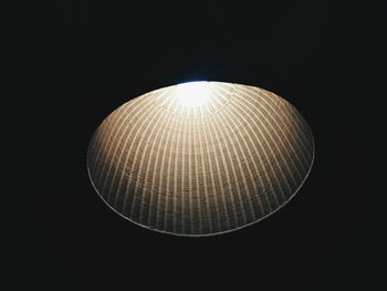 Low angle view of illuminated lights at night