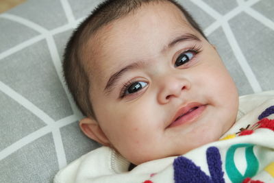 Close-up portrait of cute baby at home
