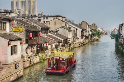 View of river amidst buildings in city