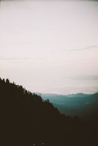 Scenic view of silhouette mountain against sky