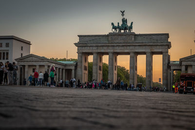Group of people in front of historical building