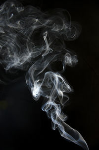 Close-up of smoke against black background