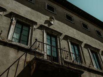 Low angle view of old building against clear sky